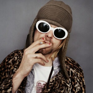 Kurt Cobain smoking, color, by Jesse Frohman - portrait with sunglasses hat and cigarette