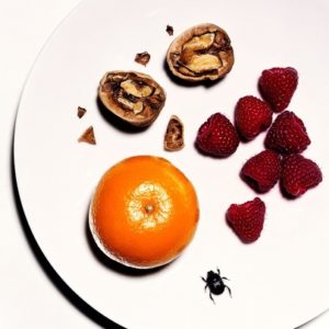 Raspberries with Walnut, plate with fruits, Nuts and Bug