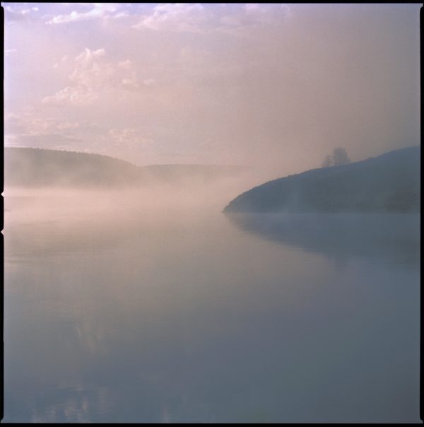 yellowstone 17 by Nigel Parry, lake and hills in purple fog