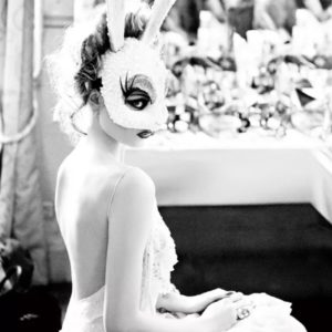 White Bunny by Ellen von Unwerth, portrait of a woman in white, backles dress and bunnymask