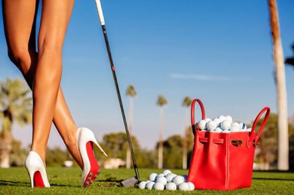 Ladies Day by Tony Kelly, Legs in Heels with red Birkin Bag filled with Golf Balls