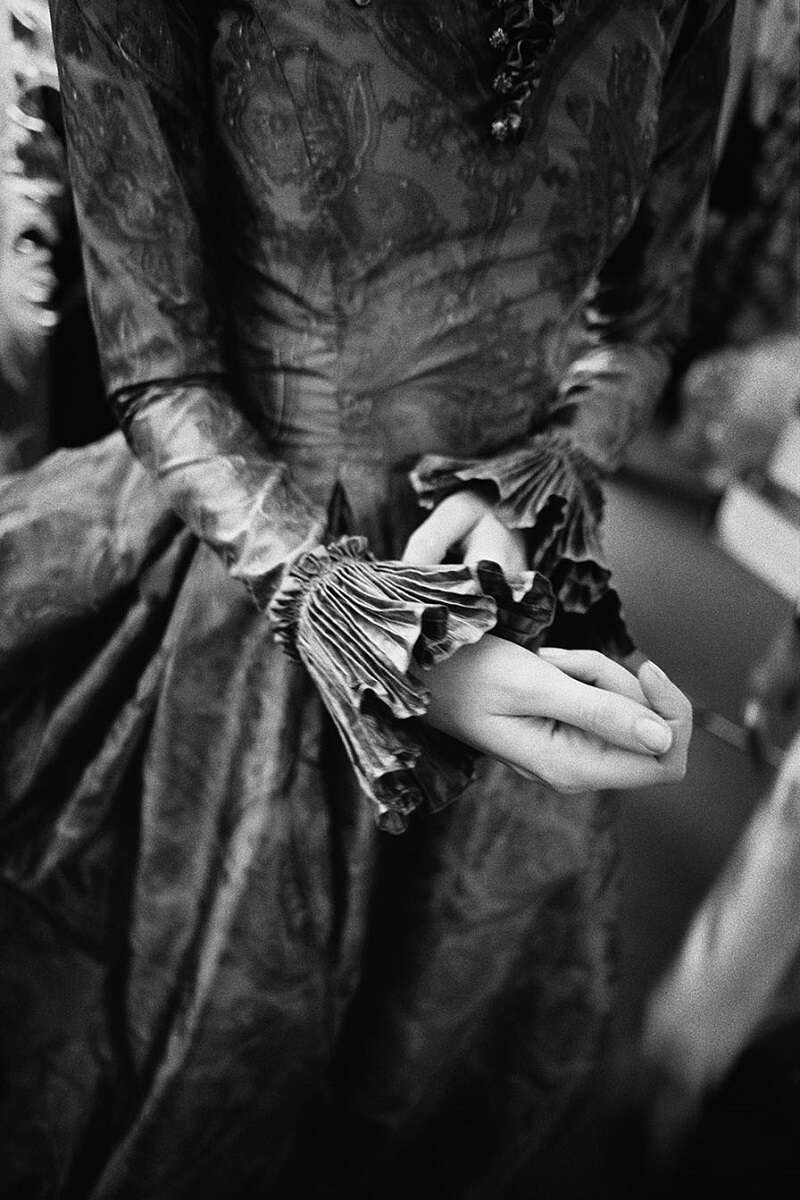 Gérard Uféras, Pierre Balmain Haute Couture, black-and-white fine art print of woman tucking at ruffled sleeve 