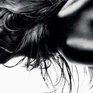 Black Summer, Ten Times Rosie 2010, by Rankin - closeup sideprofile of nude model painted black with messy hair