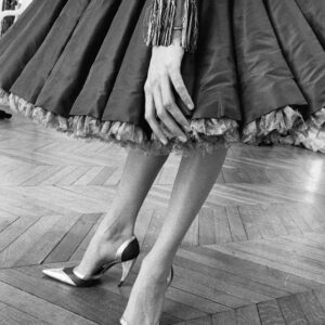 L'étoffe des rêves I by Gérard Uféras - black and white closeup of a models legs in heels and a fluffy skirt