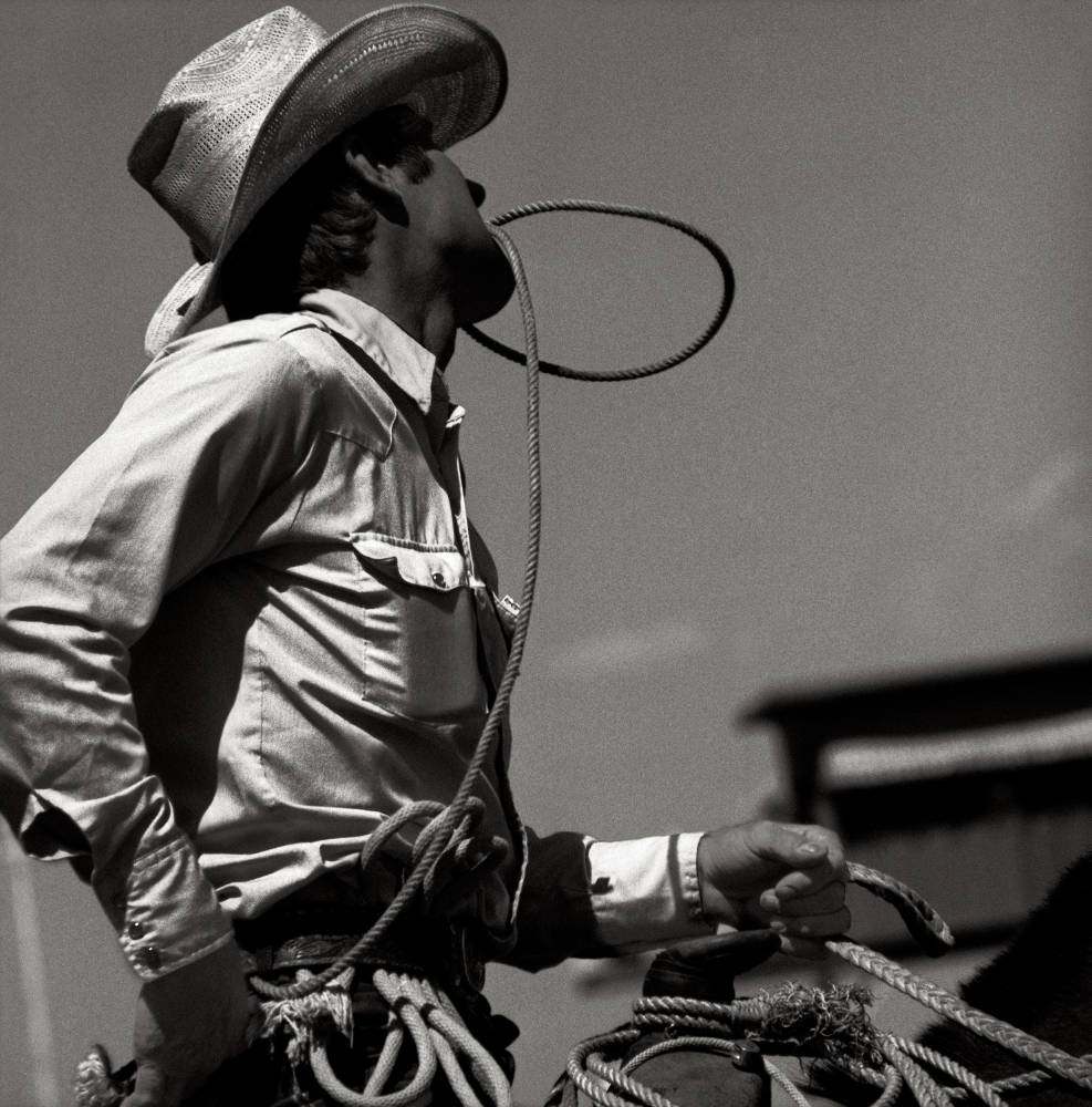 Calgary 1979, biting the rope by Albert Watson, Cowboy in sideprofile 