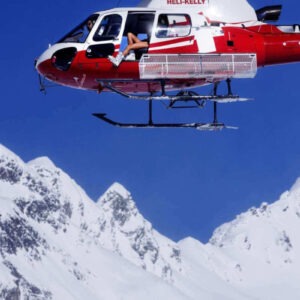 Tony Kelly, Heli Kelly! red and white helicopter above snowy mountains