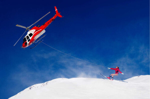 Ski Lift, St. Moritz by Tony Kelly, Helicopter pulling a Model on ski