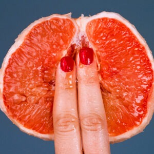 Shields, Grapefruit 2017, two fingers on a cut open fruit