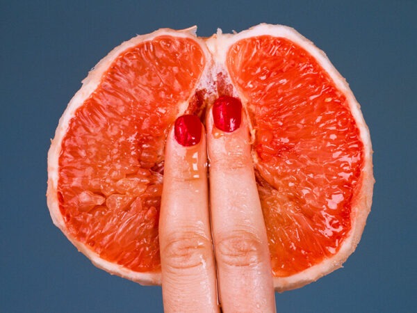 Shields, Grapefruit 2017, two fingers on a cut open fruit