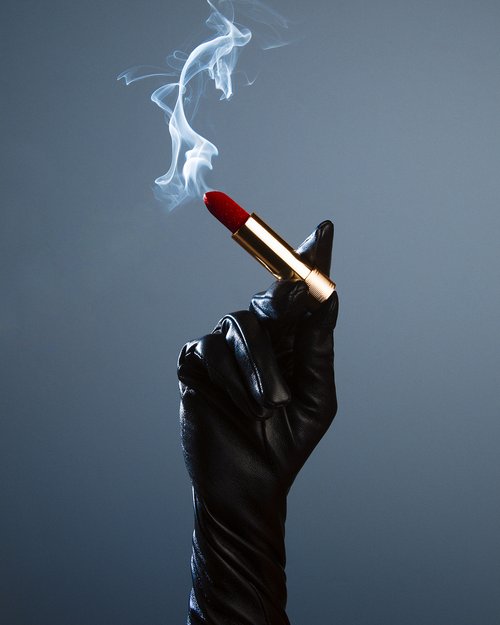 Shields, Lipstick Cigarette 2022, gloved hand holding a smoking Lipstick