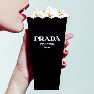 Shields, Prada Popcorn 2012, model with red lips holding a popcorn bag with the prada logo, closeup