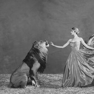 Shields, The Lion Queen, Model in dress touching a lion