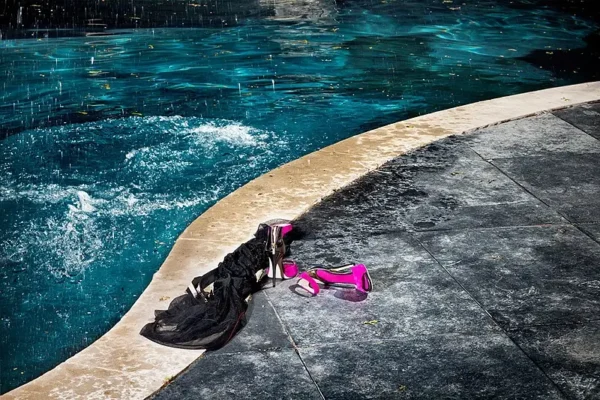 drebin splash and heels pink shoes next to a pool