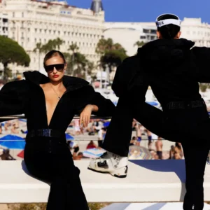 Tony Kelly Summer Ski III, two women in black snow leotards and ski gear at the beach