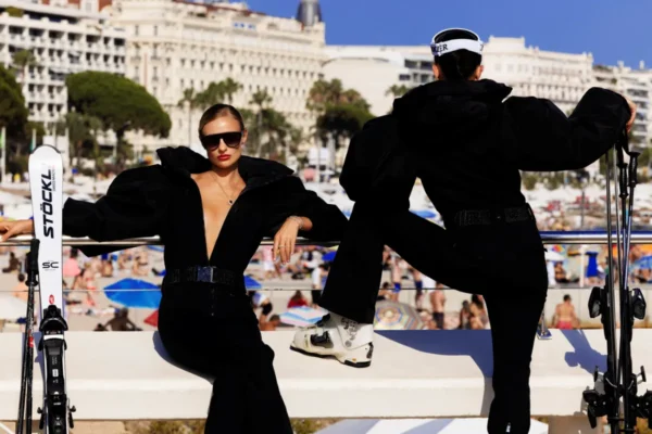 Tony Kelly Summer Ski III, two women in black snow leotards and ski gear at the beach