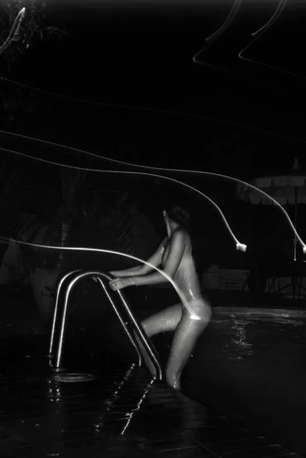 Klinko Chateau Marmont The Pool, nude model climbing out of a pool at night