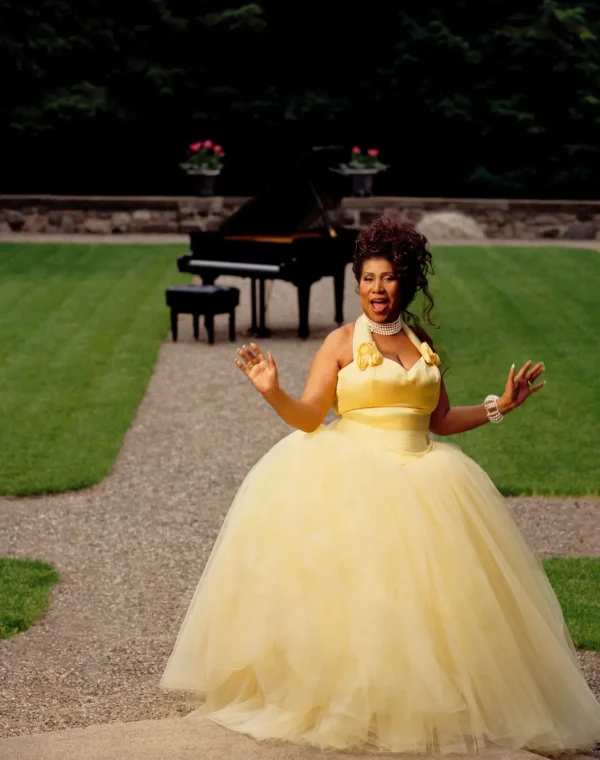 White Aretha Franklin yellow ballgown garden piano